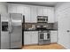 Beautiful kitchen boasts stainless steel appliances, granite countertops, and lots of cabinet space at 4910 Longcourt Se Trce # 13, Atlanta, GA 30339
