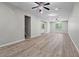 Spacious living room with laminate floors, modern ceiling fans, and recessed lighting at 4910 Longcourt Se Trce # 13, Atlanta, GA 30339