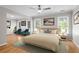 Spacious main bedroom suite with sitting area and large windows for plenty of natural light at 4910 Longcourt Se Trce # 13, Atlanta, GA 30339
