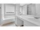 Bright bathroom with a tub and shower combination at 516 Broad Head Pt, Suwanee, GA 30024