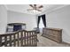 Cozy bedroom with neutral tones, dresser and ample natural light at 516 Broad Head Pt, Suwanee, GA 30024