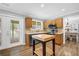 Well-equipped kitchen with stainless steel appliances, wood cabinets, and a kitchen island with a butcher block at 516 Broad Head Pt, Suwanee, GA 30024