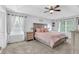 Spacious bedroom with tray ceiling and large windows at 516 Broad Head Pt, Suwanee, GA 30024