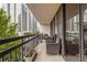 Serene balcony view with seating, plants, and a glimpse of the surrounding cityscape at 1130 Piedmont Ne Ave # 803, Atlanta, GA 30309