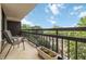 Relaxing balcony overlooking a neighborhood with mature trees and blue skies at 1130 Piedmont Ne Ave # 803, Atlanta, GA 30309