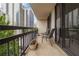 Inviting condo balcony featuring a city view and room for seating with potted plants at 1130 Piedmont Ne Ave # 803, Atlanta, GA 30309