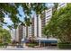 Luxury high-rise condo building featuring multiple balconies and a beautifully designed entrance at 1130 Piedmont Ne Ave # 803, Atlanta, GA 30309