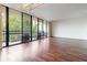 Bright living room with hardwood floors, large glass sliding doors and a balcony with furniture at 1130 Piedmont Ne Ave # 803, Atlanta, GA 30309