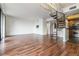 Bright living room featuring hardwood floors and a spiral staircase connecting to an open kitchen at 1130 Piedmont Ne Ave # 803, Atlanta, GA 30309