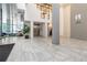 Modern condo lobby with marble floors, high ceilings, and large windows offering plenty of natural light at 1130 Piedmont Ne Ave # 803, Atlanta, GA 30309