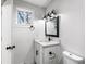 Charming bathroom with modern lighting, a granite countertop vanity and an elegant mirror at 1150 Rankin St # 6H, Stone Mountain, GA 30083