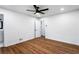 Spacious bedroom features hardwood floors, a ceiling fan, and an ensuite bathroom at 1150 Rankin St # 6H, Stone Mountain, GA 30083