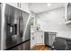 Modern kitchen with stainless steel appliances, updated white cabinets, and marble backsplash at 1150 Rankin St # 6H, Stone Mountain, GA 30083