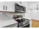 Stylish kitchen featuring stainless steel appliances, modern white cabinets, and sleek countertops at 1150 Rankin St # 6H, Stone Mountain, GA 30083