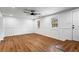Spacious living room featuring laminate flooring, crisp white walls, and natural light at 1150 Rankin St # 6H, Stone Mountain, GA 30083