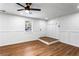 Bright living room with modern ceiling fan, wood-look floors, and updated trim at 1150 Rankin St # 6H, Stone Mountain, GA 30083