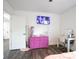 Bright bedroom features hardwood floors, a dresser, and a TV for comfort and entertainment at 1285 Avon Sw Ave, Atlanta, GA 30310