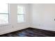 Clean bedroom with hardwood floors and two large windows offering natural light at 1285 Avon Sw Ave, Atlanta, GA 30310