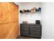 Organized closet with a sliding barn door and shelving, maximizing storage space for clothes and accessories at 1285 Avon Sw Ave, Atlanta, GA 30310
