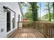 Charming wooden deck with railing and a view of the lush backyard, ideal for outdoor enjoyment at 1285 Avon Sw Ave, Atlanta, GA 30310