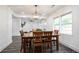 Bright dining room with a wooden table and chairs, adjacent to the living room for open-concept living at 1285 Avon Sw Ave, Atlanta, GA 30310