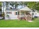 Charming single-story home with a covered front porch and well-maintained lawn, perfect for suburban living at 1285 Avon Sw Ave, Atlanta, GA 30310