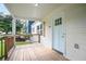 Inviting front porch with wood flooring and a light blue front door, offering a cozy entryway at 1285 Avon Sw Ave, Atlanta, GA 30310