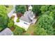 Aerial view of house showing roof, back deck, driveway, and surrounding trees at 2695 Rangewood Ne Dr, Atlanta, GA 30345