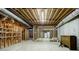 Exposed basement showing unfinished walls and ceiling, and a refrigerator at 2695 Rangewood Ne Dr, Atlanta, GA 30345