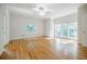 Light-filled bedroom featuring hardwood floors and large windows with a view of nature at 2695 Rangewood Ne Dr, Atlanta, GA 30345