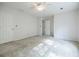 This spacious bedroom has a ceiling fan, neutral walls and carpet, and two doors at 2695 Rangewood Ne Dr, Atlanta, GA 30345