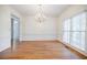 Spacious dining room with natural light, hardwood floors, and wainscoting, ideal for Gathering meals at 2695 Rangewood Ne Dr, Atlanta, GA 30345