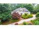 Charming home with a well-manicured front yard, colorful landscaping, and a private driveway at 2695 Rangewood Ne Dr, Atlanta, GA 30345