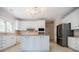Modern kitchen with white cabinets, stainless steel appliances, and a kitchen island, perfect for cooking at 2695 Rangewood Ne Dr, Atlanta, GA 30345