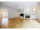 Bright and airy living room with hardwood floors, a fireplace, and built-in shelving, offering comfort and style at 2695 Rangewood Ne Dr, Atlanta, GA 30345