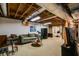 Spacious basement with couch, tv, and open ceiling perfect for relaxing at 7720 Milam Rd, Winston, GA 30187