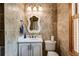 Bathroom featuring tiled walls, vanity with sink, and toilet at 7720 Milam Rd, Winston, GA 30187