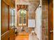 Bathroom featuring tiled walls, hardwood floors, and shower with curtain at 7720 Milam Rd, Winston, GA 30187