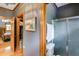 Bathroom showcasing a shower, toilet, and view into an adjacent bedroom at 7720 Milam Rd, Winston, GA 30187