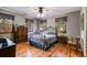 Bedroom featuring hardwood floors, natural light, and ceiling fan at 7720 Milam Rd, Winston, GA 30187