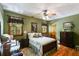 Comfortable bedroom with natural light, vintage furniture, and hardwood floors at 7720 Milam Rd, Winston, GA 30187