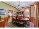 Classic dining room with hardwood floors, traditional décor, a chandelier, and ample space for entertaining guests at 7720 Milam Rd, Winston, GA 30187
