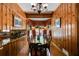 Dining room featuring hardwood floors, wood paneled walls, and table with seating for eight at 7720 Milam Rd, Winston, GA 30187