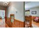 Hallway with hardwood floors and staircase leading to the second floor at 7720 Milam Rd, Winston, GA 30187