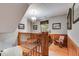 Hallway with hardwood floors, wood paneled walls, and stairs at 7720 Milam Rd, Winston, GA 30187