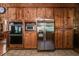 Spacious kitchen featuring stainless steel appliances and ample wooden cabinetry for plenty of storage at 7720 Milam Rd, Winston, GA 30187