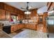 Well-equipped kitchen featuring wooden cabinetry, modern appliances, and ample counter space for meal preparation at 7720 Milam Rd, Winston, GA 30187