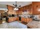 Spacious kitchen with wooden cabinets, granite countertops, and modern appliances, perfect for culinary enthusiasts at 7720 Milam Rd, Winston, GA 30187