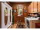 Laundry room with washer, dryer, storage cabinet, and decorative mirror at 7720 Milam Rd, Winston, GA 30187