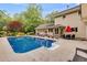 Serene backyard with a stunning pool, lush landscaping, and outdoor seating areas at 7720 Milam Rd, Winston, GA 30187